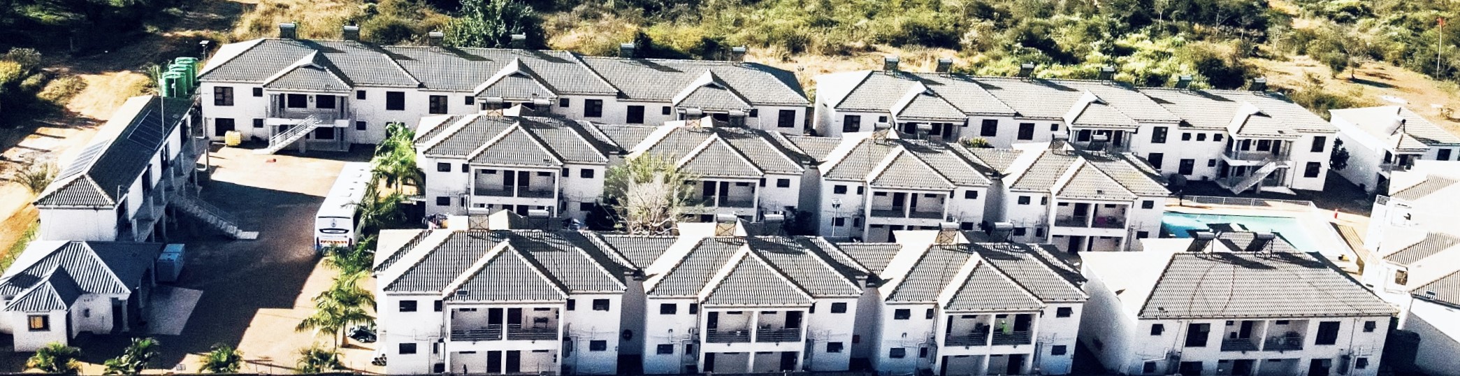 Aerial view of Muthathe Student Village showing residence blocks and swimming pool