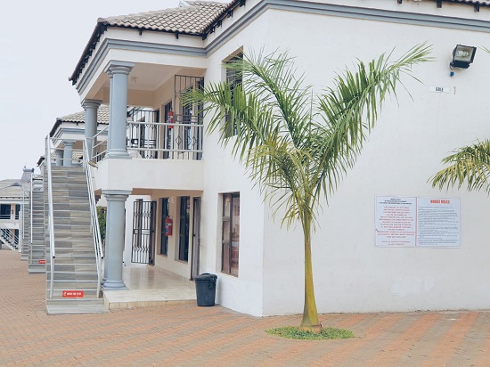 Muthathe Student Village entrance and building