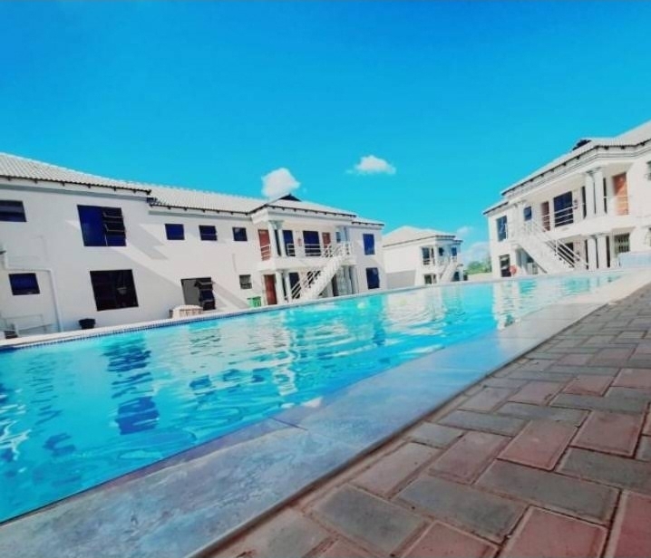 Sunny view of the swimming pool at Muthathe Student Village